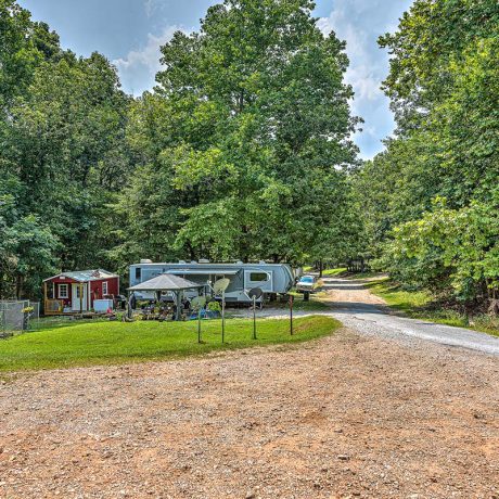 rv parked among trees